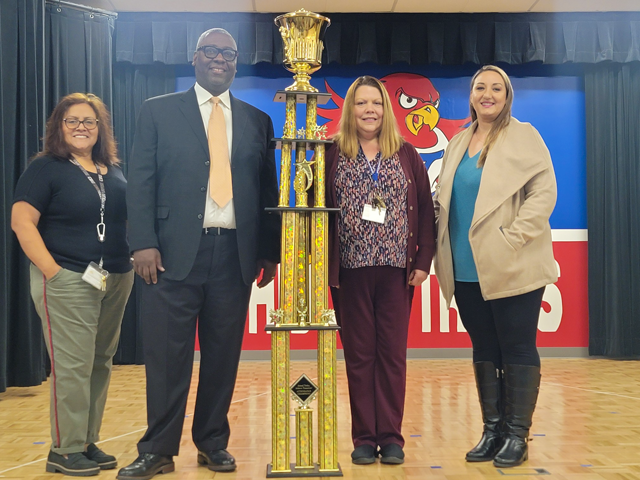 Hidden Trails receiving Attendance Award trophy