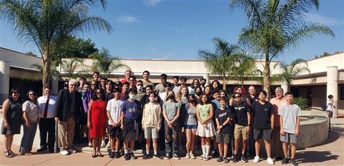 Principal Yarboi poses with the Ayala Architecture and Engineering Class