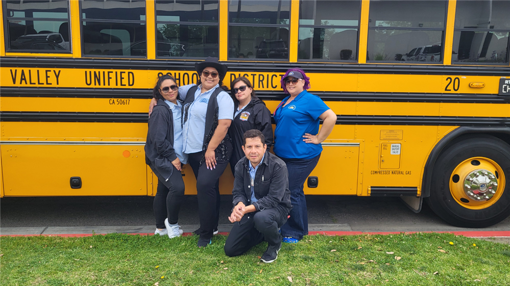  The CVUSD bus driver team posing in front of their school bus